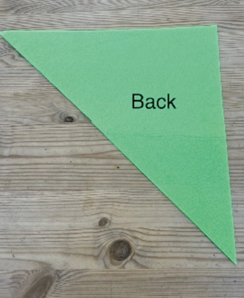 An image of a felt triangle with the word Back written on it